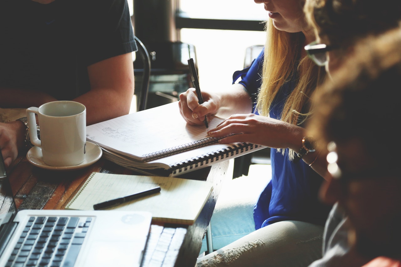 People sitting at a table learning